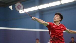 Badminton player executing a powerful smash