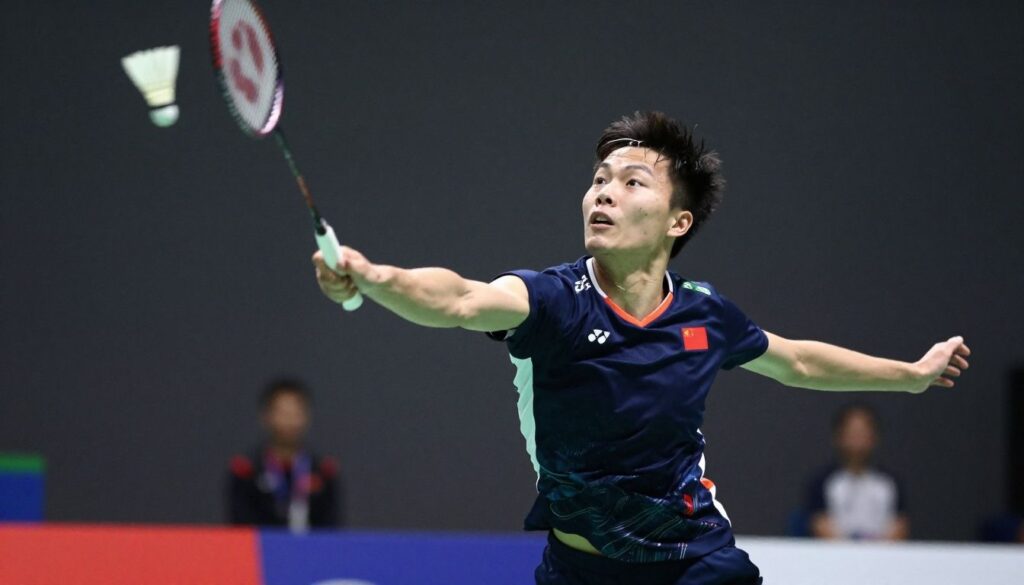 Badminton player performing a powerful overhead smash.