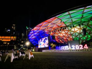 A large building lit up with colorful lights